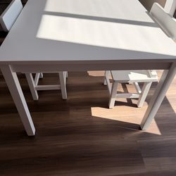 Table with two wooden chairs, white color for children