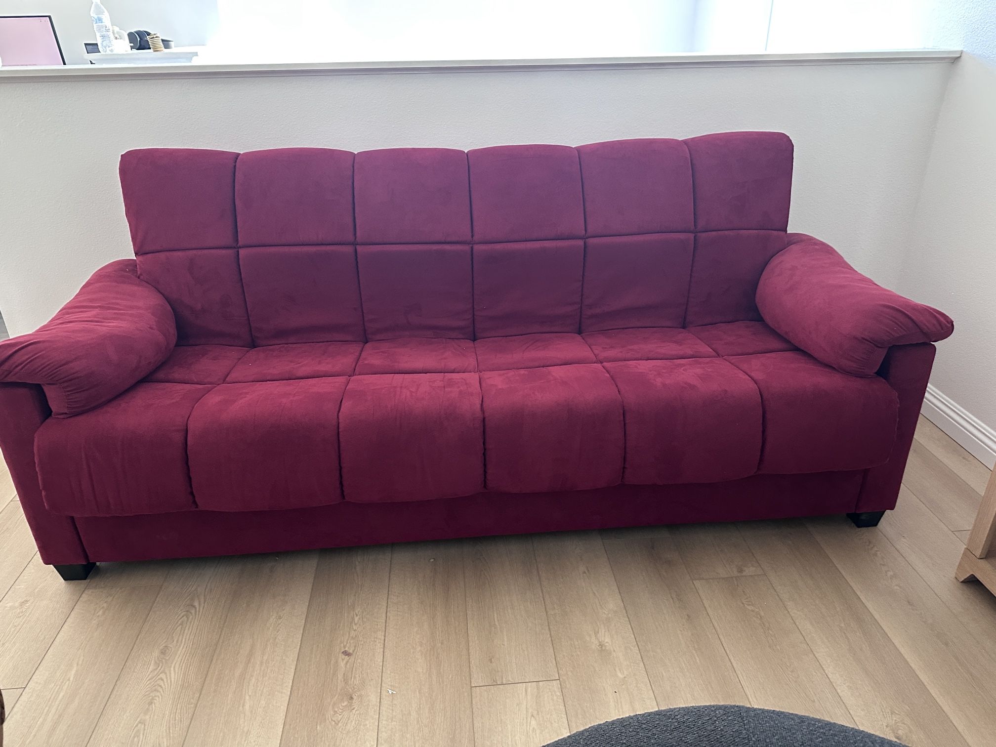 Burgundy Futon Folds Down As A Bed