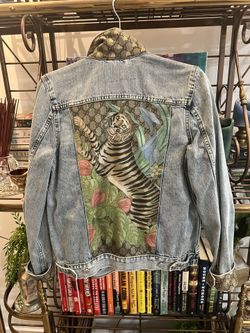 ONE OF A KIND - GUCCI denim jacket featuring vintage silk Gucci scarf accents.