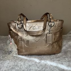 Coach Gold Signature Embossed Leather Bag