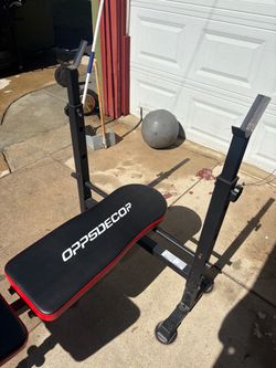 Adjustable bench press with bar and plates