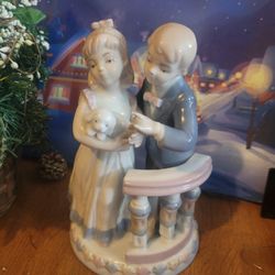 Boy Trying To Kiss A Girl Figurine