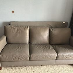 Macy’s Gray  leather couch in great condition!