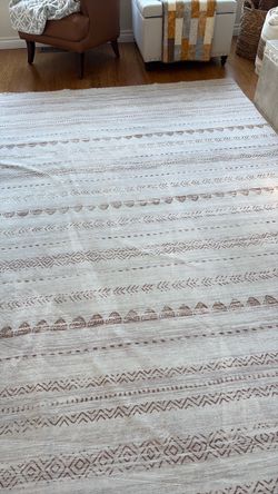 Two washable rugs, one is 8 x 10, one is 5 x 7,.