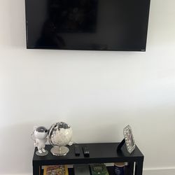 43”  Vizio TV with small black table