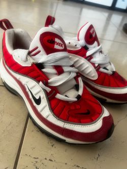 Nike Air Max 98 sneakers feature a striking red,