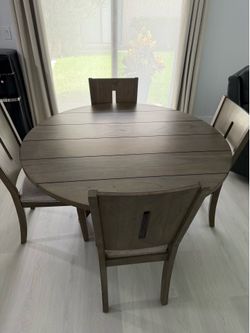 solid wood dining room table with four chairs and excellent condition like brand-new$450