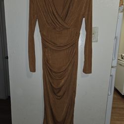 Long, super stretch dress. Bronze color with shoulder pads Size L