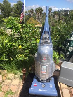 Like New Bissel cord rewind 15 inch wide path 12 Amp With wand crevice And pet tool