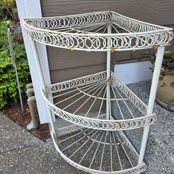 Conner metal indoor/outdoor flower stand.