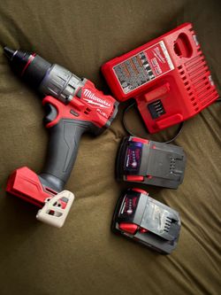 Milwakee hammer drill with batteries