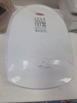 white George Foreman "Lean Mean Fat-Reducing Grilling Machine".