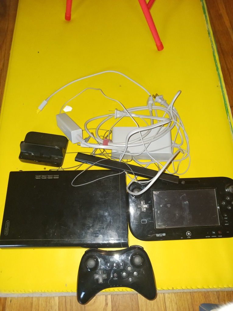 Wii U with controller and game pad. Games cost extra.