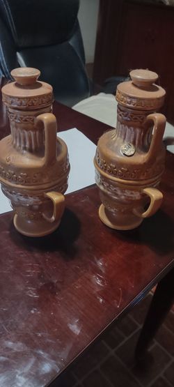 vintage ceramic or stoneware jugs with lids