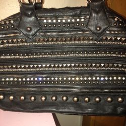 MMS black silver studded purse. The faux leather on the handles and inner top part are shredding
