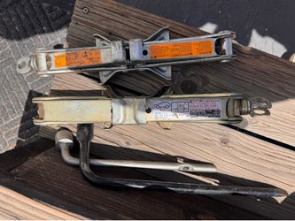Pair of car jacks and tire irons
