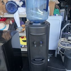 Hot and cold bottom loading water dispenser. 