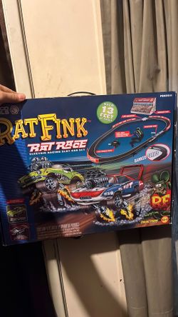 Collectible Rat Fink electric racing slot car set with 2 X-traction slot cars a 1957 Chevy Corvette & a 1969 Dodge Charger Daytona rat Fink wing nut.