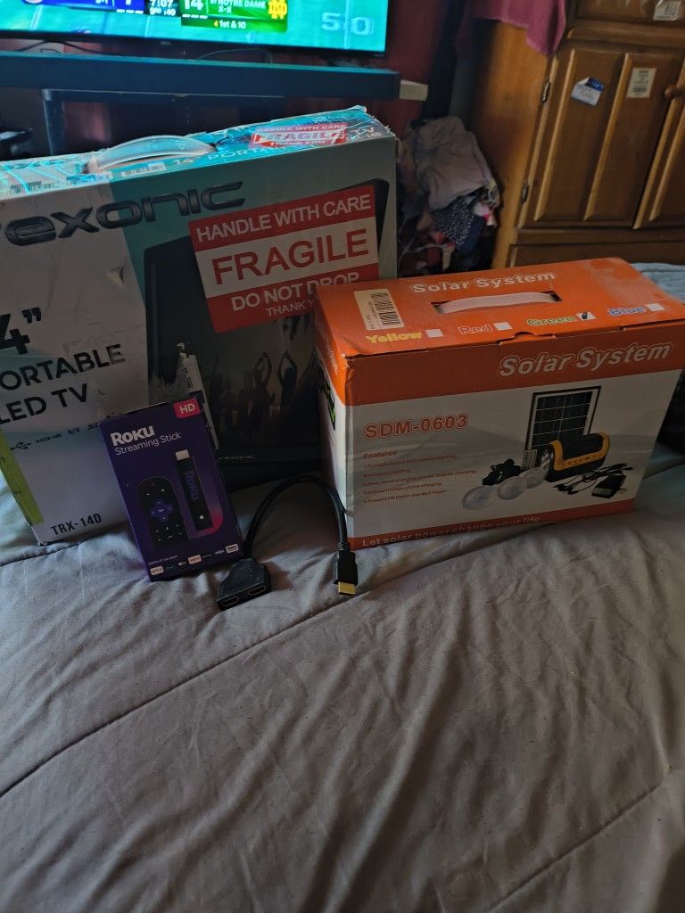 New Trexonic Portable Rechargeable 14" 720p LED TV with New Roku TV Streaming Stick And Power Set.