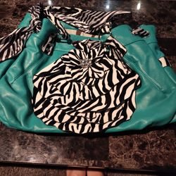 Large Teal Purse With Black And White Decor On It