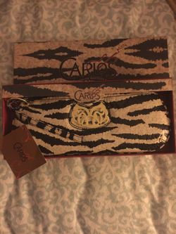 Carlos Santana wristlet