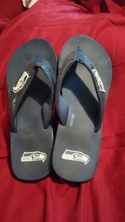 Sports your team All Summer Long. Seahawks flip flops size 7