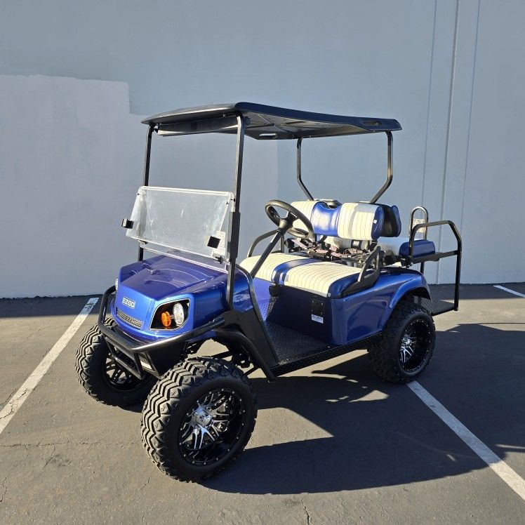 2015 E-Z-GO S4 4-Passenger Lifted 48-Volt Golf Cart in Metallic Blue