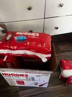 Diapers - size 1 Huggies and pampers