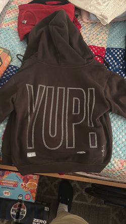 Travis Scott brown hoodie.