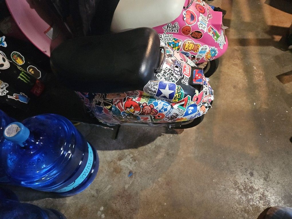 Moped scooter.