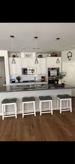 Four 24 inch high counter bar stools
