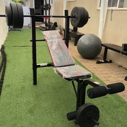 Gym Equipment Adjustable Bench press, barbell, leg developer and 100lbs of weight