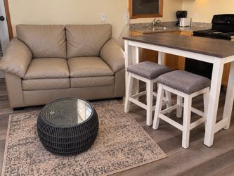 4-piece living room/dining set. Includes a comfortable beige loveseat