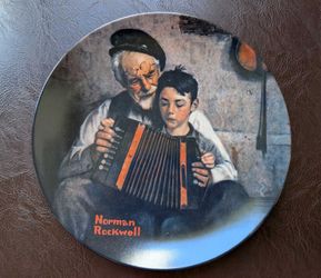 This is a "The Music Maker" collector plate from the 1981 Rockwell Heritage Collection, featuring art by Norman Rockwell.