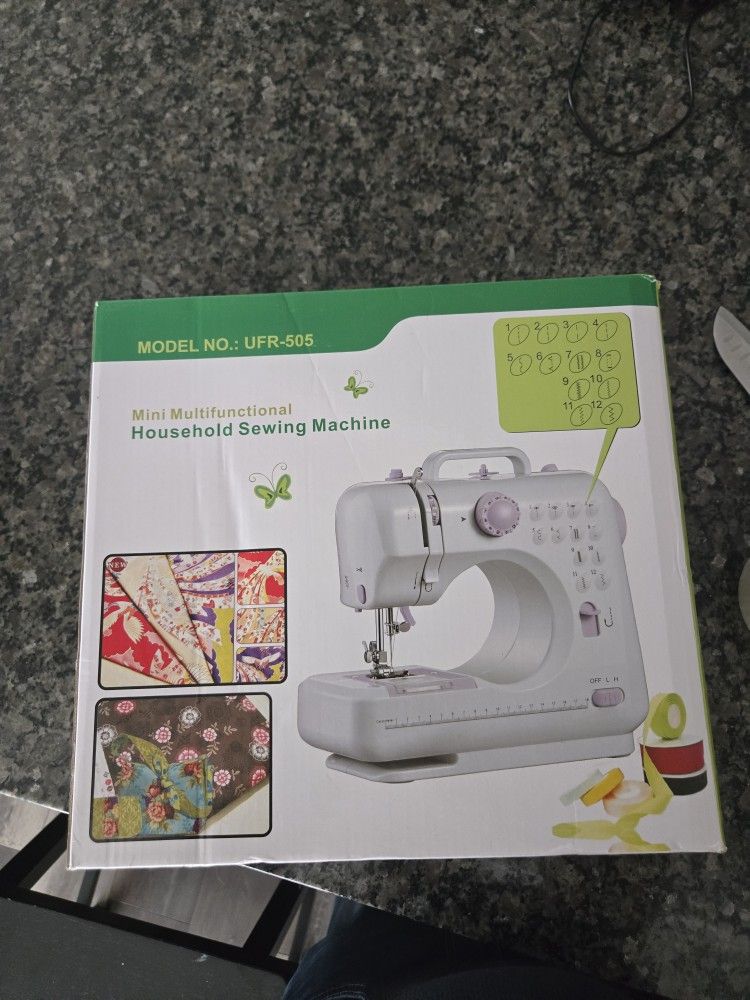 Mini Multifunctional Household Sewing Machine UFR-505 NIB Purple WhiteThe Mini Multifunctional Household Sewing Machine UFR-505 is a compact electric 