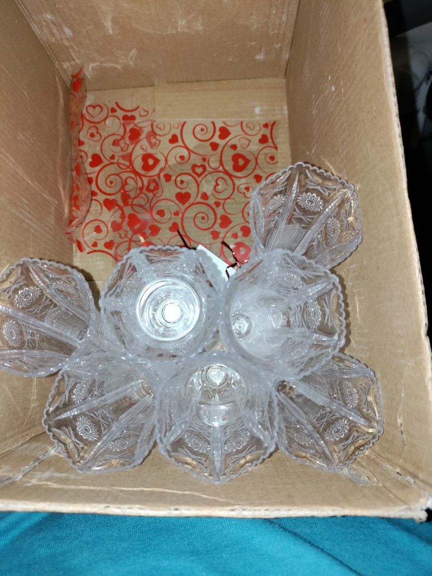 Seven Small Plastic Flower Vases.