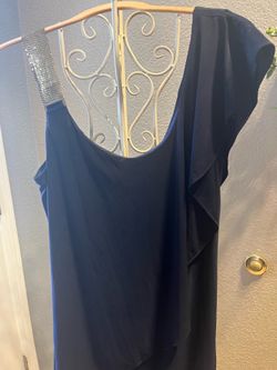 Navy blue dressy dress with gold Lemay chain, and ruffle