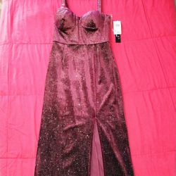The dress is likely a burgundy or wine color with silver glitter/sequin accents and the brand is Trixxi. 