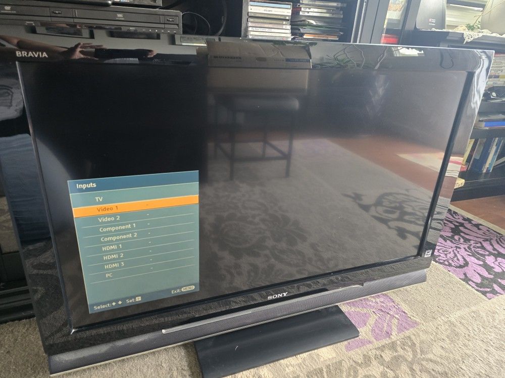 40" Sony Bravia flat screen TV older model good for older game systems w/ remote.