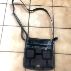 Cute Long Adjustable Strap Purse. Has One Zipper Opening Inside and Outside of Purse.