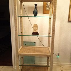 Vintage Henry Link 5 Tier Wicker Display Shelves With Lighting 76" H x 29.5" W x 19" D. It has 3 glass 2 wicker shelves. Strong sturdy. 