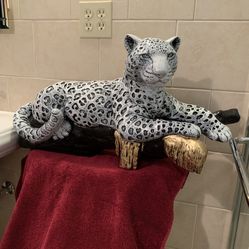 Snow Leopard On The Log Statue 
