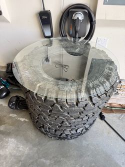 3 off road tires new or u can used it for a table on  a shop or decor