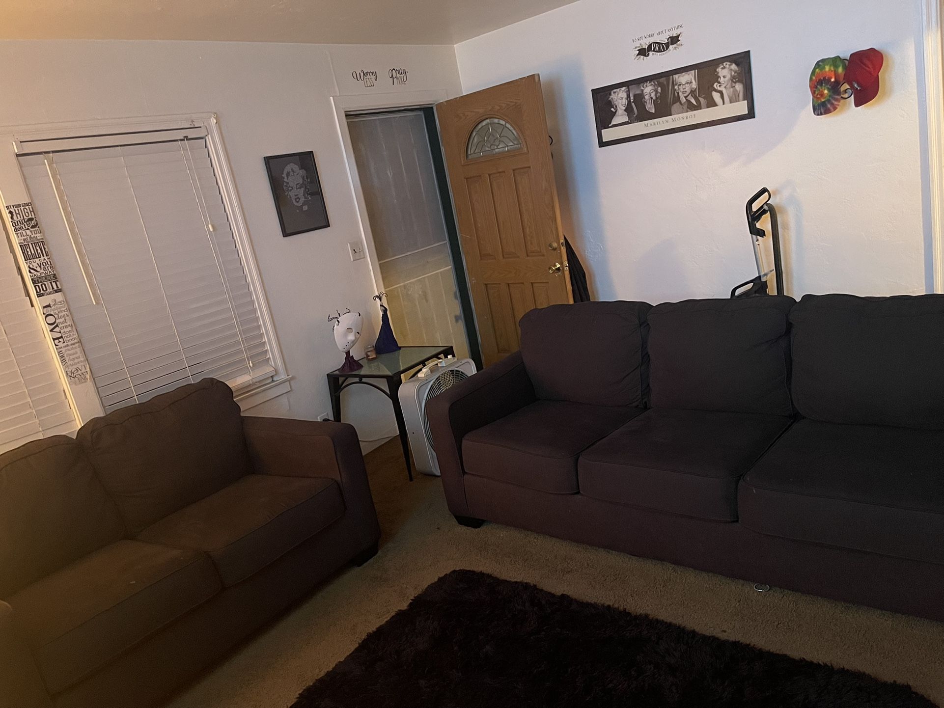 Couches blackish gray color they are like new I bought them not too long ago for $1000 I want to sell to buy a sectional