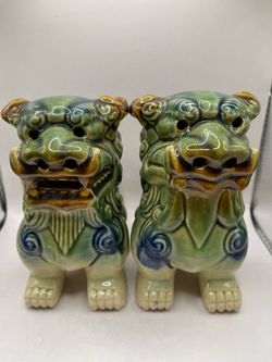 These items are a vintage pair of green and blue glazed ceramic guardian figures, commonly known as Foo Dogs (or Chinese Guardian Lions)