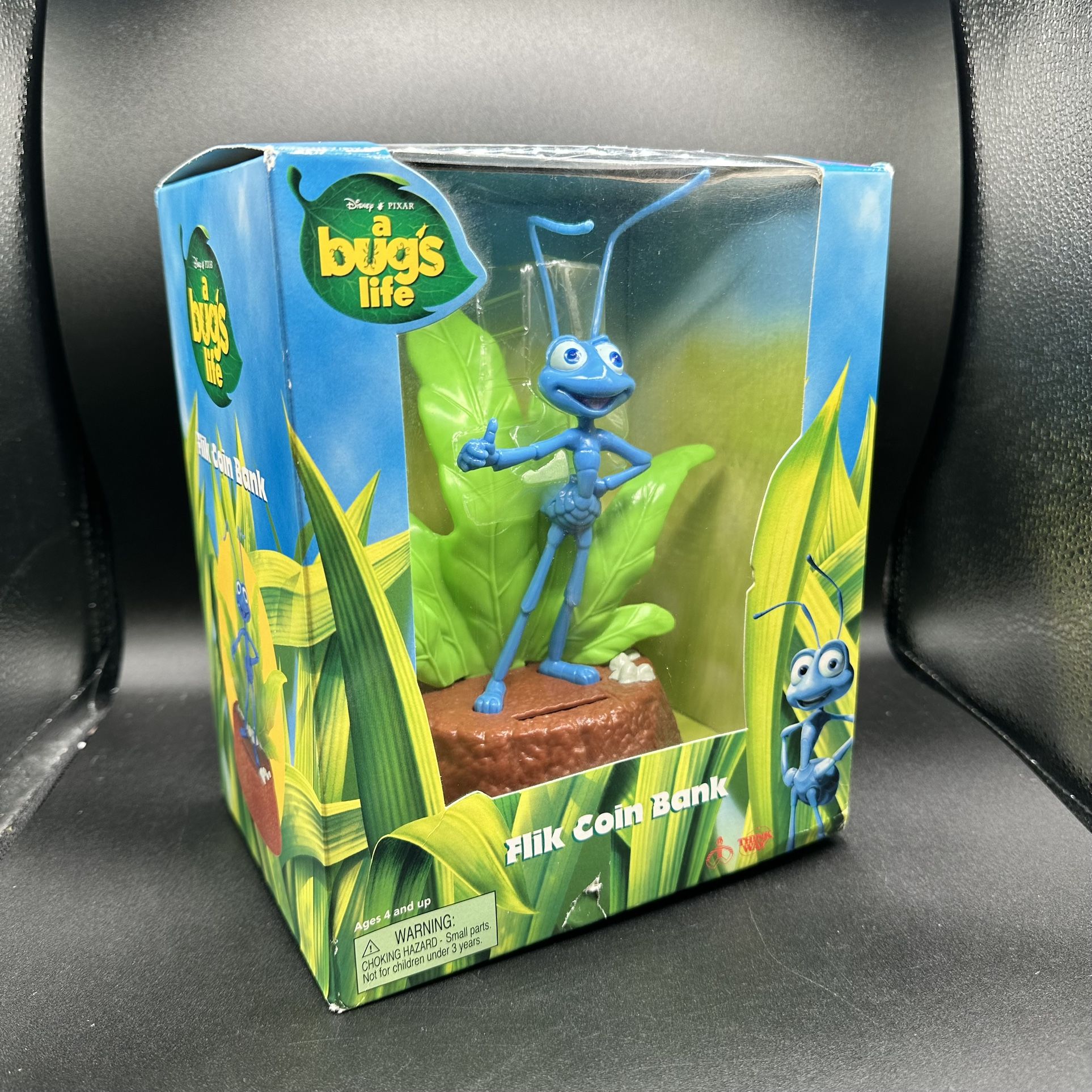 New* A Bugs Life “Flik” Coin Bank