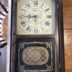 Very old wall clock the frame on it three or 4 inches thick