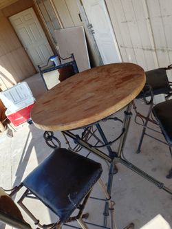 Table 4 chairs .real cow skin on back of chairs