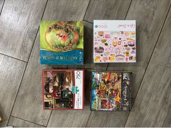 Lot of 4 puzzles 750-100 piece
