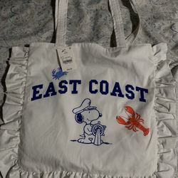 White Snoopy  canvas-style fabric with a ruffled edge 